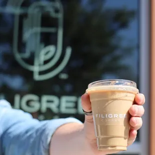  person holding a cup of coffee