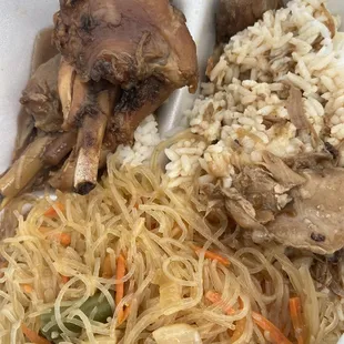 rice, meat and vegetables in a styrofoam container