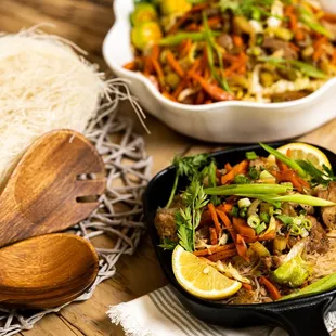 a bowl of noodles and a bowl of meat