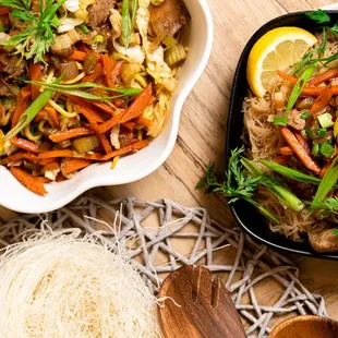 a bowl of noodles with meat and vegetables