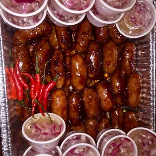 a tray of fried chicken and onions