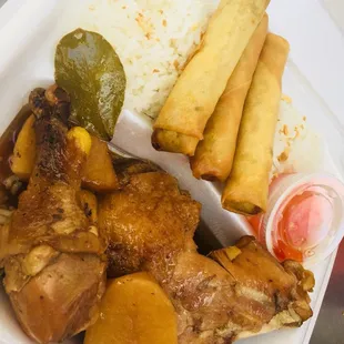 chicken, rice, and vegetables in a styrofoam container
