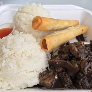 a plate of food with rice and meat