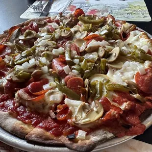 Flippo&apos;s deluxe! Cheese, sausage, pepperoni, mushroom, green pepper, and sweet onion