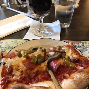 Sicilian pizza with everything but anchovies and pineapple. Glass of excellent chianti