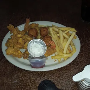 a plate of fried fish and fries