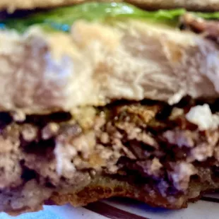 Three meat sandwich, chicken, burger, and bacon. It is wonderful.