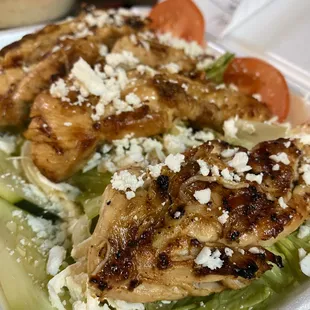 Chicken over Greek salad.