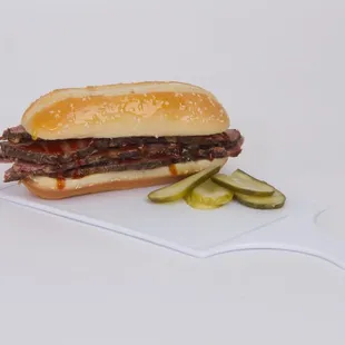 Our tender brisket sandwich goes great with onion rings, fried Jalepeños, chips or cole slaw!