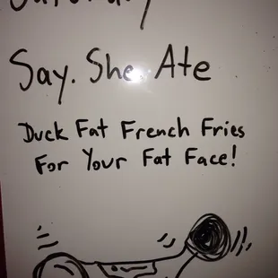 a whiteboard with a drawing of a person holding a tennis racquet