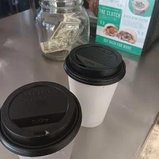 two cups of coffee on a counter