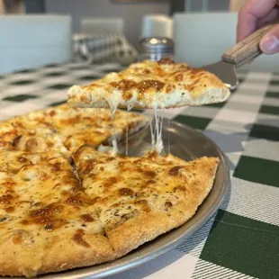 Cheesy White Pie Specialty Pizza with Creamy Garlic Sauce, Cheddar, Feta, and Parmesan cheeses