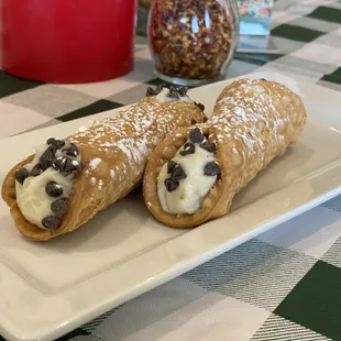 Two House-Made Cannoli, Fried Pastry Dough, Sweet Cream Filling, and Powdered Sugar