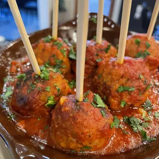 meatballs with sauce and toothpicks