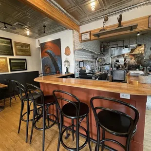 a kitchen with bar stools