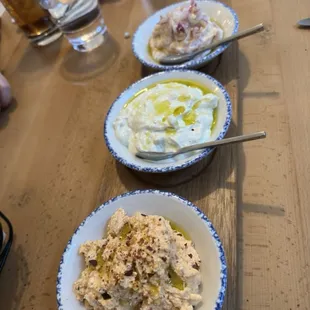 TRIO OF SPREADS -Served with pita bread- Tzatziki (yogurt, garlic) Tirokafteri (spicy feta)  Taramosalata (cured cod roe)