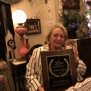 Owner and Founder of Filomena Ristorante presented with 35th Anniversary plaque.