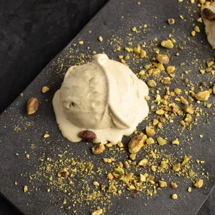 a scoop of ice cream and pistachios