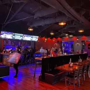 a bar with people sitting at tables