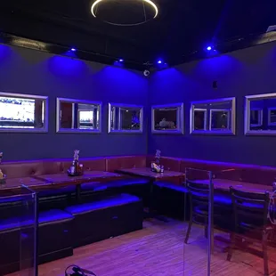 a bar with purple lighting