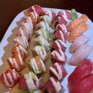 From left to right Big Bang, Tornado, In and out, salmon, yellowtail, and tuna nigiri