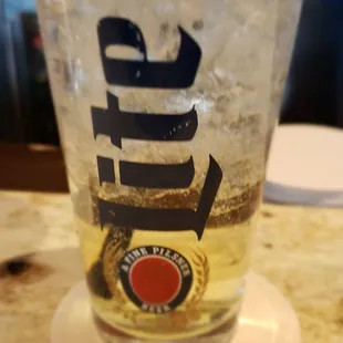 a glass of beer on a table