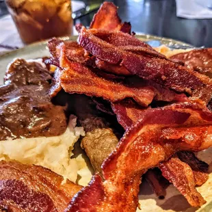 plate of bacon and mashed potatoes