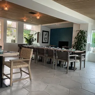 a dining room with tables and chairs