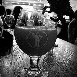 a glass of beer on a table