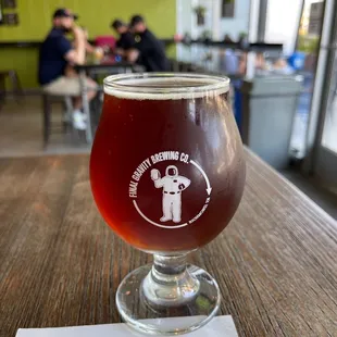 a glass of beer on a table