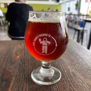 a glass of beer on a table
