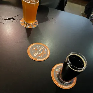 a pint of beer and a pint of beer on a table