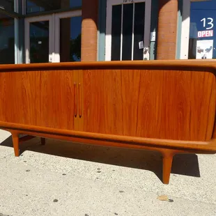 This Flasted tambour door teak credenza won't last long.