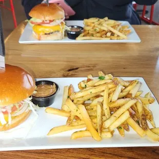 Chicken Sandwich And Fries In Front.  FBC Burger And Fries In Back.