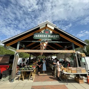 people shopping at the farmers market