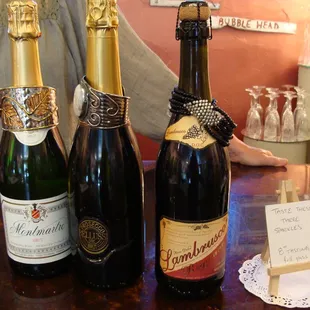 three bottles of wine on a table