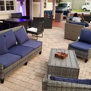 Outdoor patio with large seating areas.