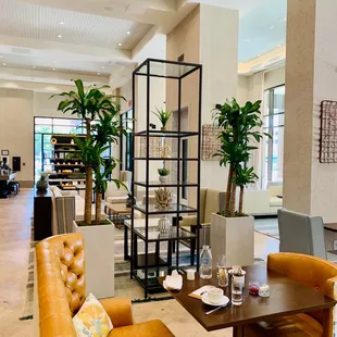 a large living room with leather furniture