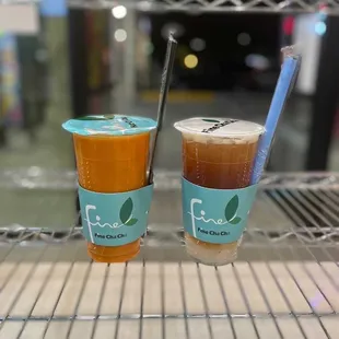 two cups of tea and a straw