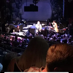 a view of a concert with a band on stage