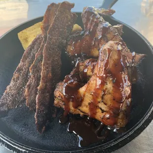 a plate of ribs and chips
