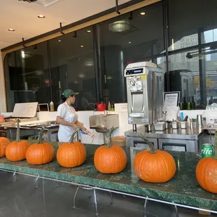 a man preparing pumpkins in a kitchen