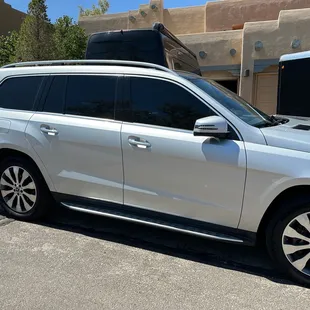 Front windows are now tinted to match side rear windows. Temps inside the car are much cooler, and improved privacy + security