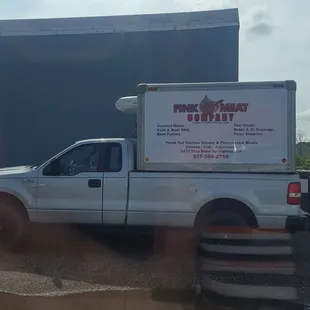 a truck parked in front of a building