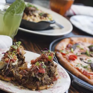 Grab Bites &amp; Cocktails like our Basilando and Vaca Frita Tostones