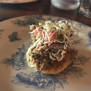 Tostones Topped With Vaca Frita