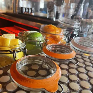 a variety of condiments on a bar