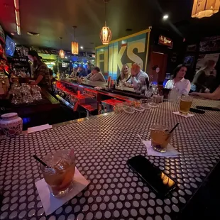 a bar with a checkered table cloth