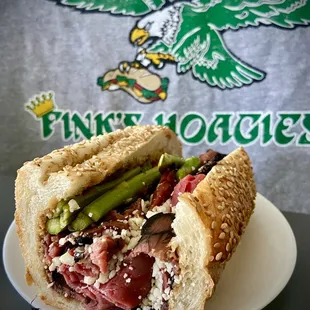 a sandwich with meat and asparagus