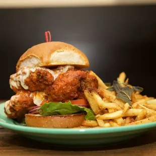 a fried chicken sandwich with french fries